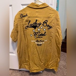 Men’s gently worn Lucky Brand Bowl-a-Rama sizeL distressed yellow Bowlers Shirt